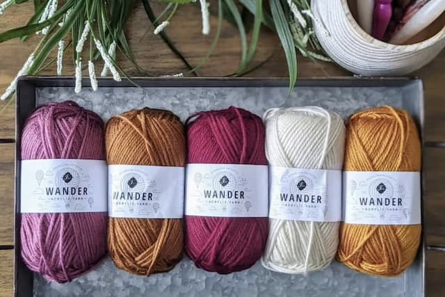 5 warm colours of Furls Wander Acrylic Yarn
