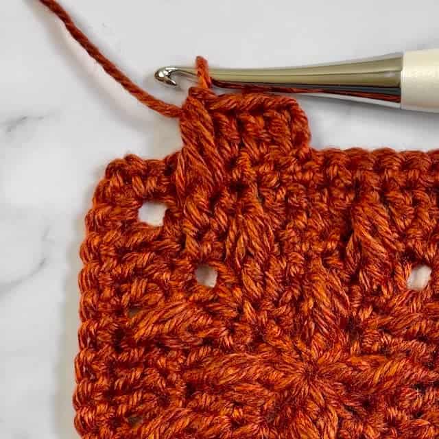 Closeup of how to perform the front post crochet puff stitch
