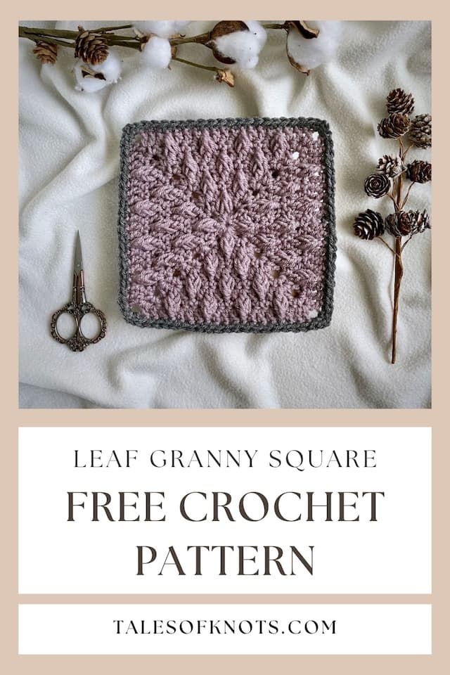 mauve textured leaf crochet granny blanket square with grey border, on cream fleece blanket with pine cone and scissors